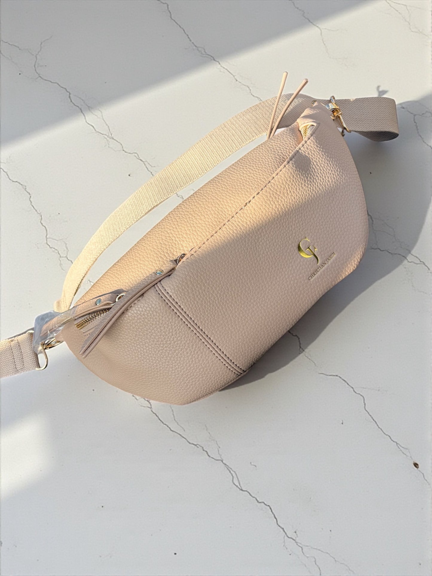 This Large Fanny Pack is a versatile and practical accessory for everyday use. With its sleek black design, it provides ample storage space while keeping your belongings easily accessible. Made for convenience and functionality, this Fanny Pack is a must-have for any on-the-go individual.